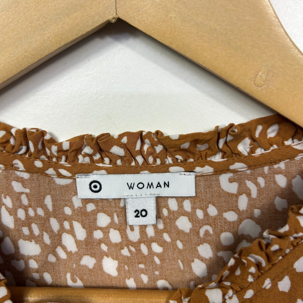Brown and white spotted dress label detail view