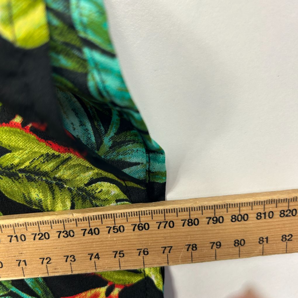 Colourful floral fabric detail with measuring tape