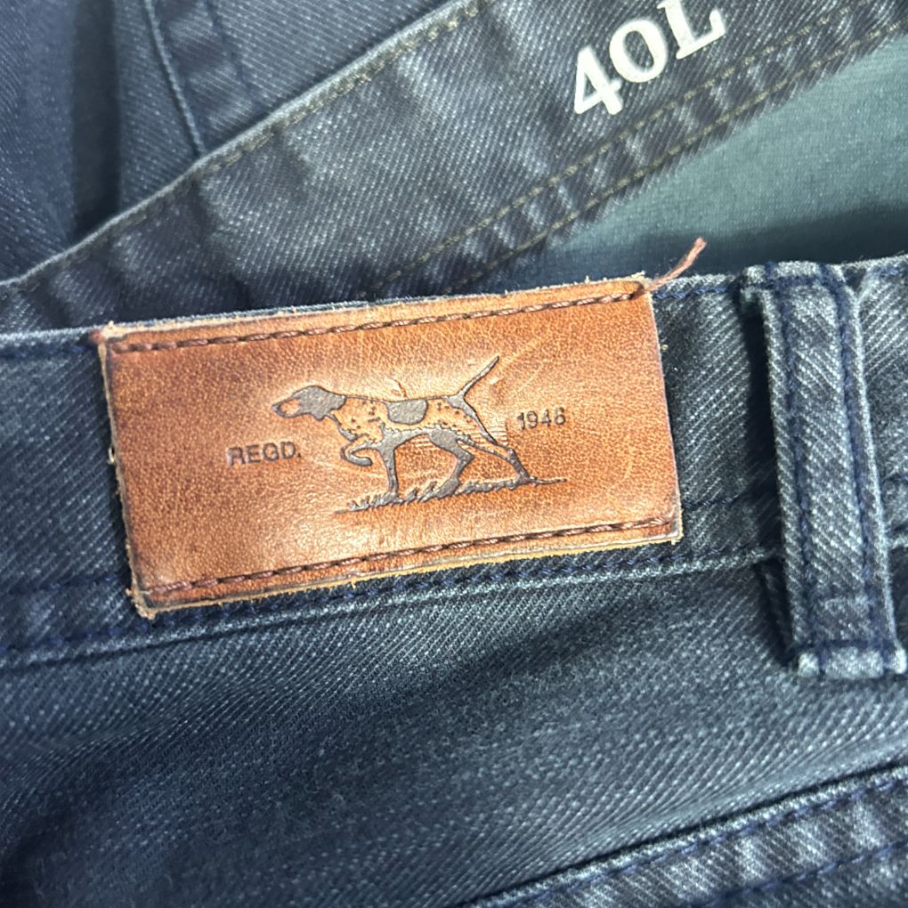 Brown leather label detail on denim jeans