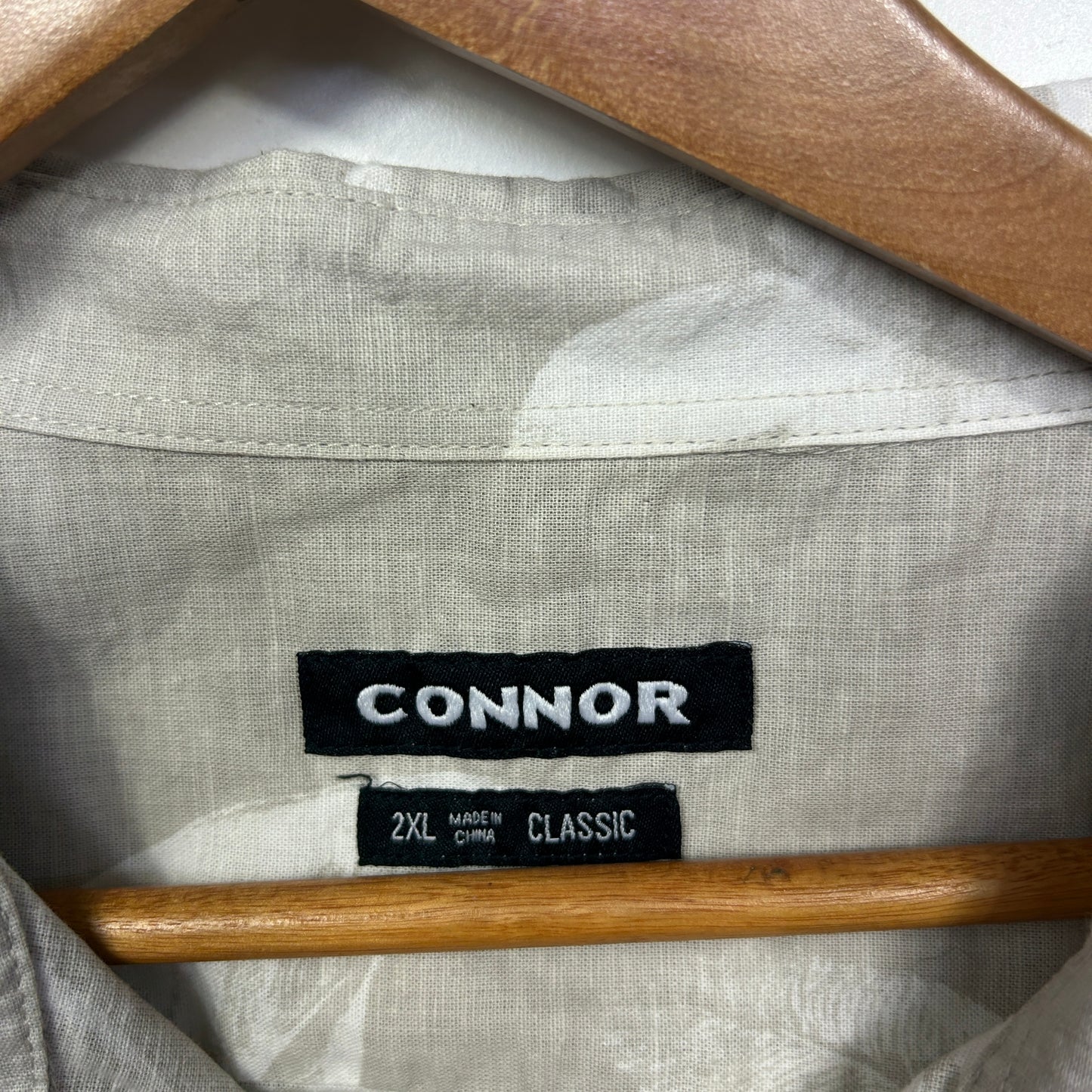 Light grey linen shirt label detail view