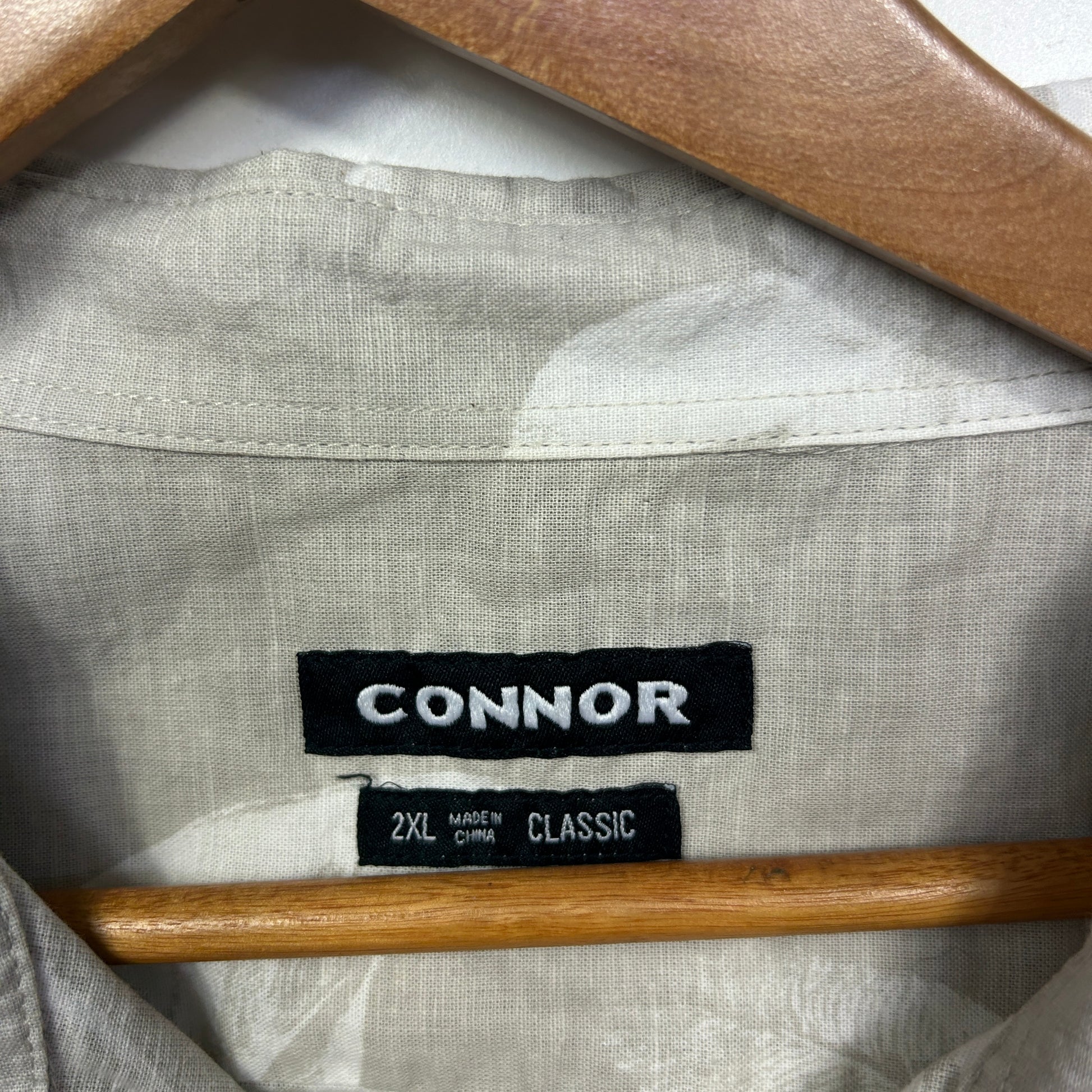 Light grey linen shirt label detail view