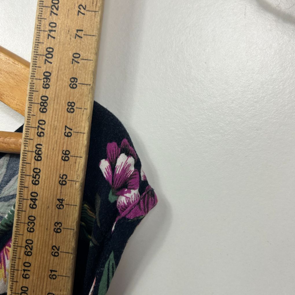Black top with pink floral detail view