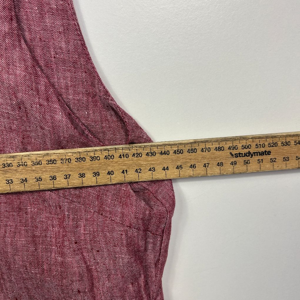 Burgundy fabric with measuring tape detail view