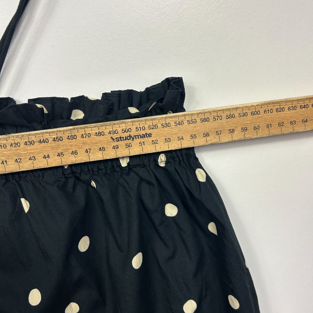 Black skirt with cream polka dots detail view