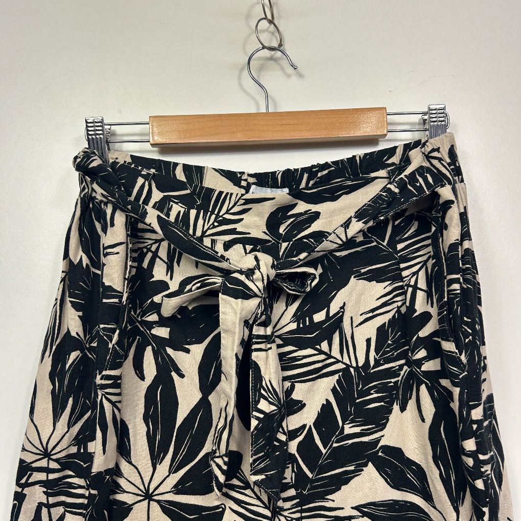 Black and cream leaf print pants front view