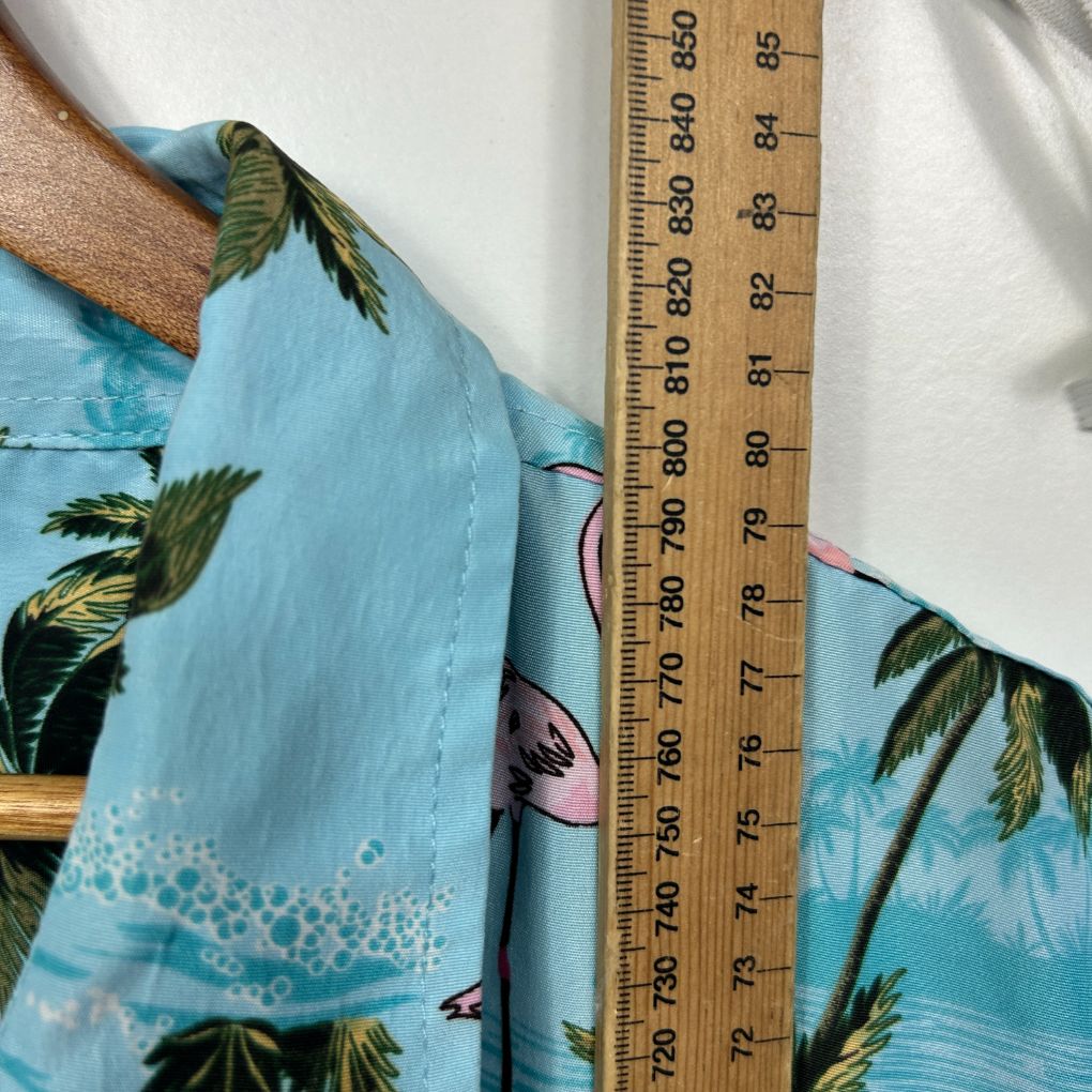 Blue tropical shirt with palm tree print detail view