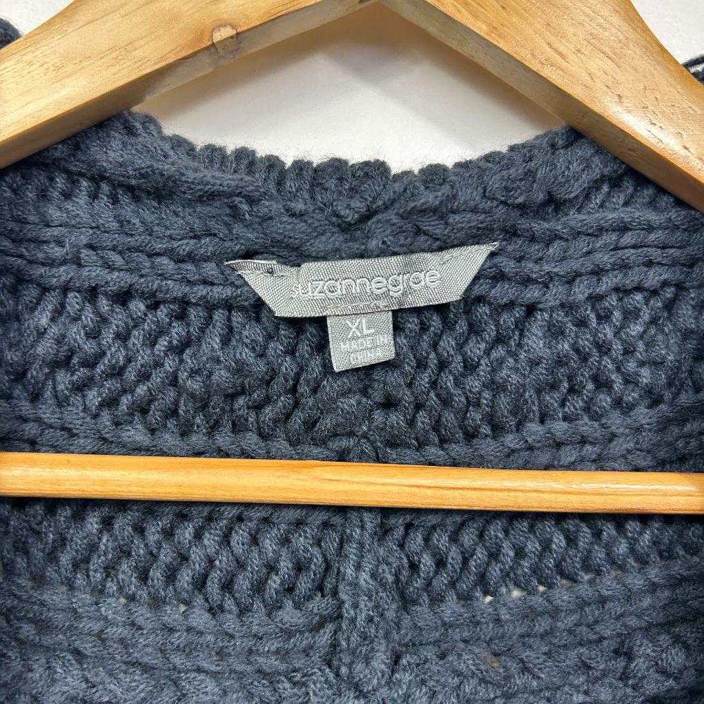 Dark grey cable knit sweater label and neckline detail view