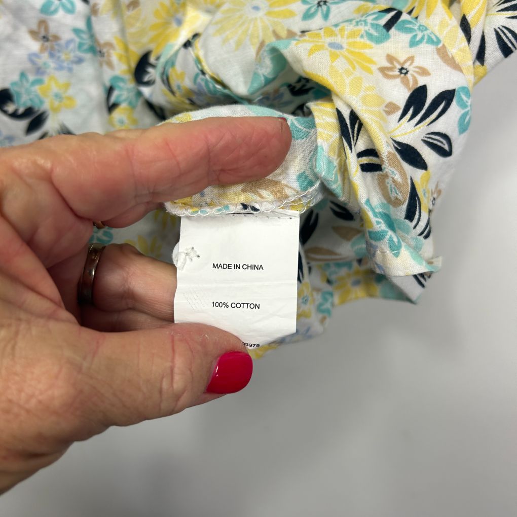 Yellow floral blouse label detail view