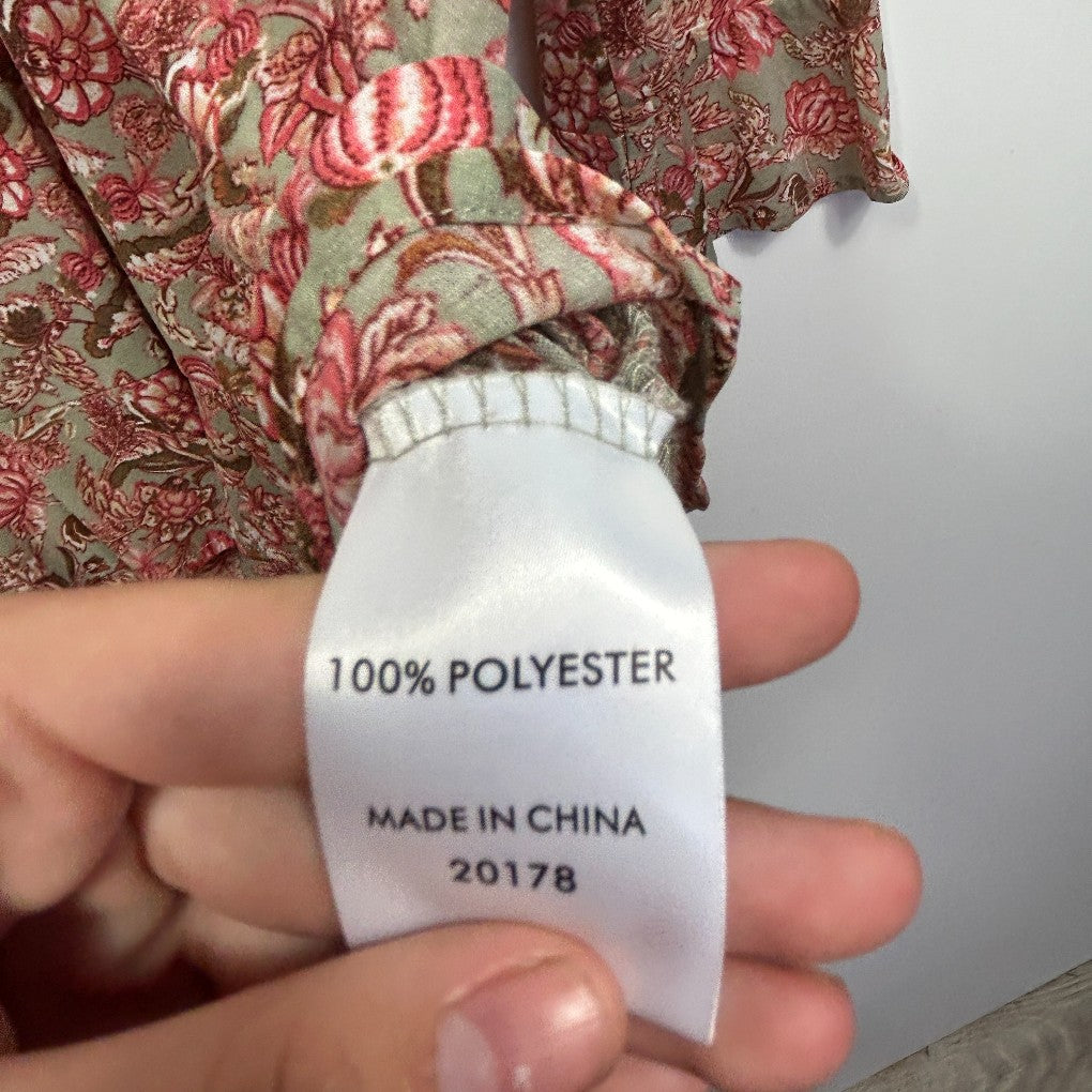 Clothing label detail showing 100% polyester composition