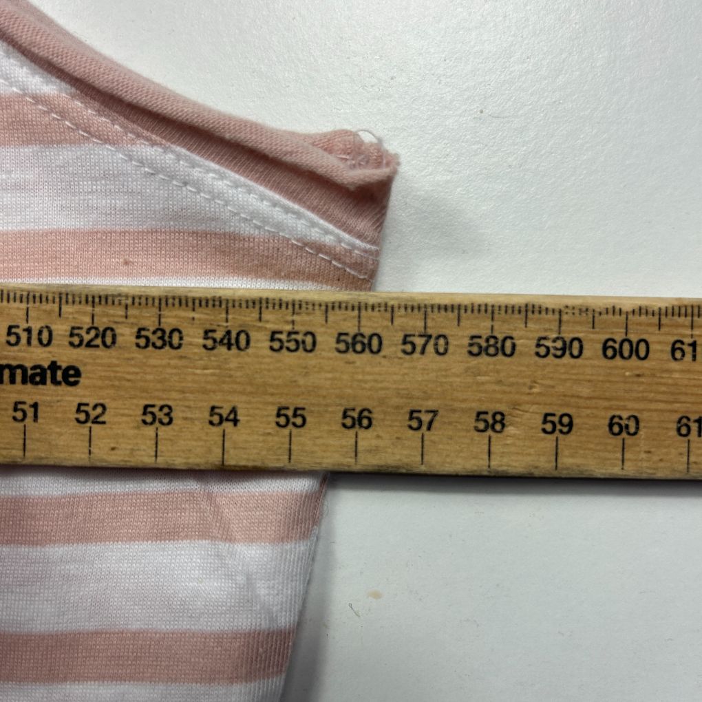 Pink and white striped fabric detail view with measurement ruler