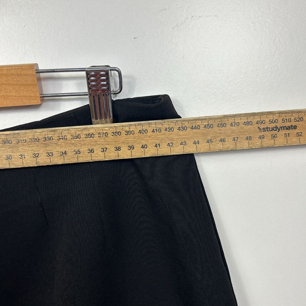 Black pants front view with measuring tape