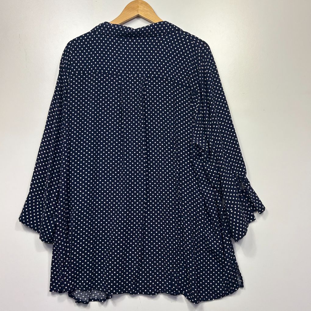 Navy blue polka dot tunic front view