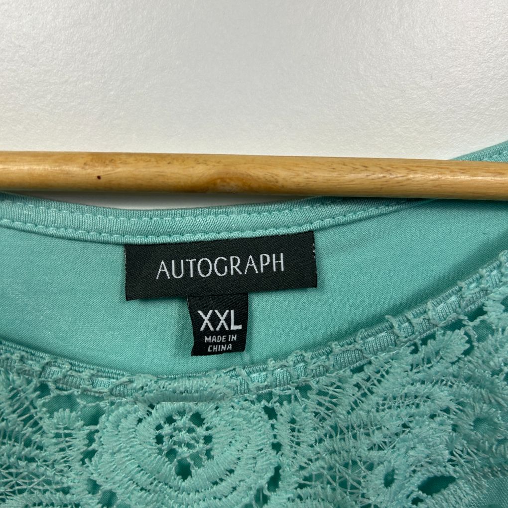 Turquoise lace top label detail view