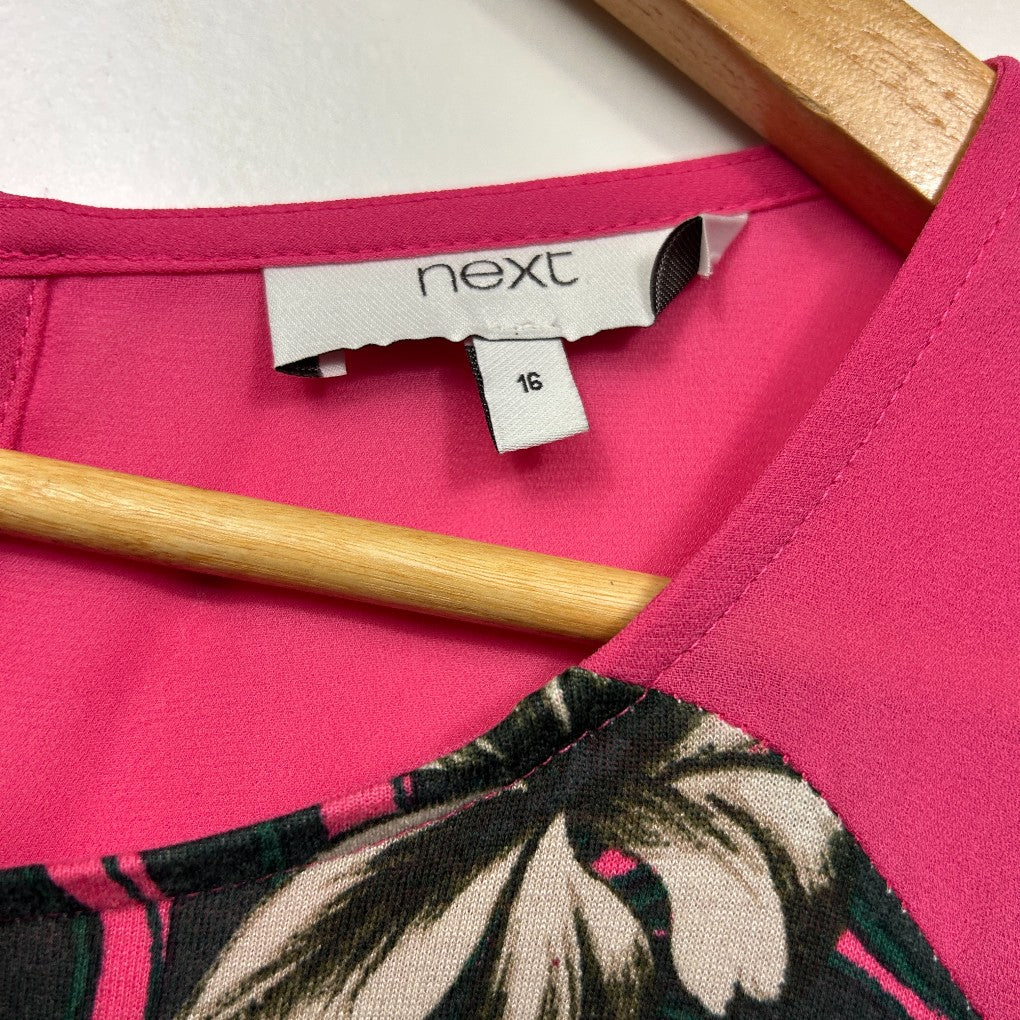 Pink top with floral detail label view