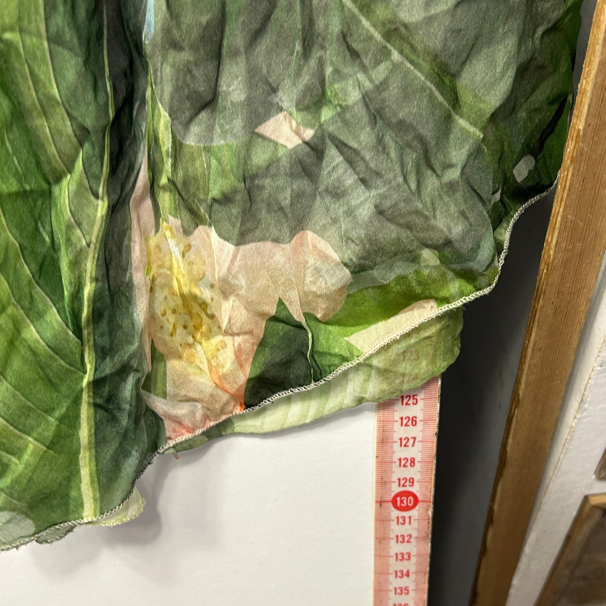 Green sheer fabric detail view