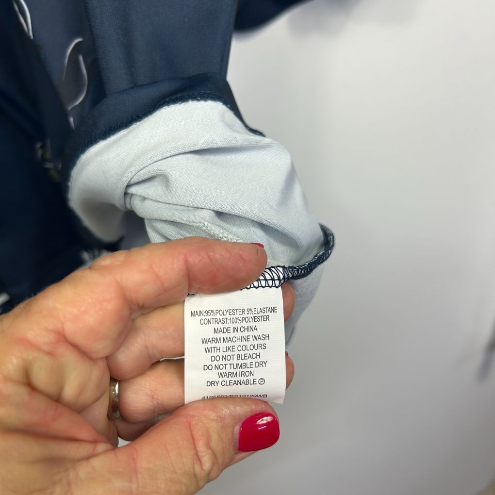 Navy blue jacket with white collar detail view