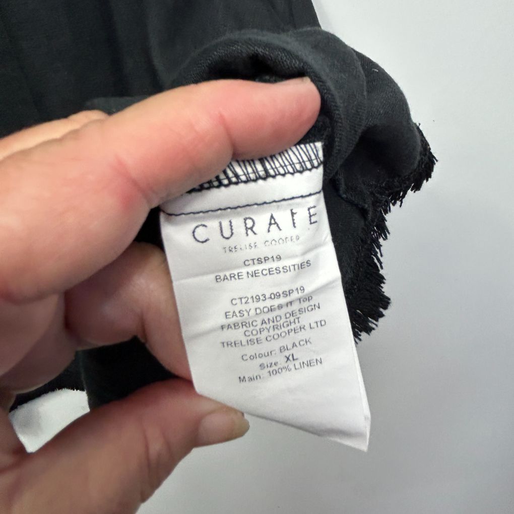 Black garment label detail view