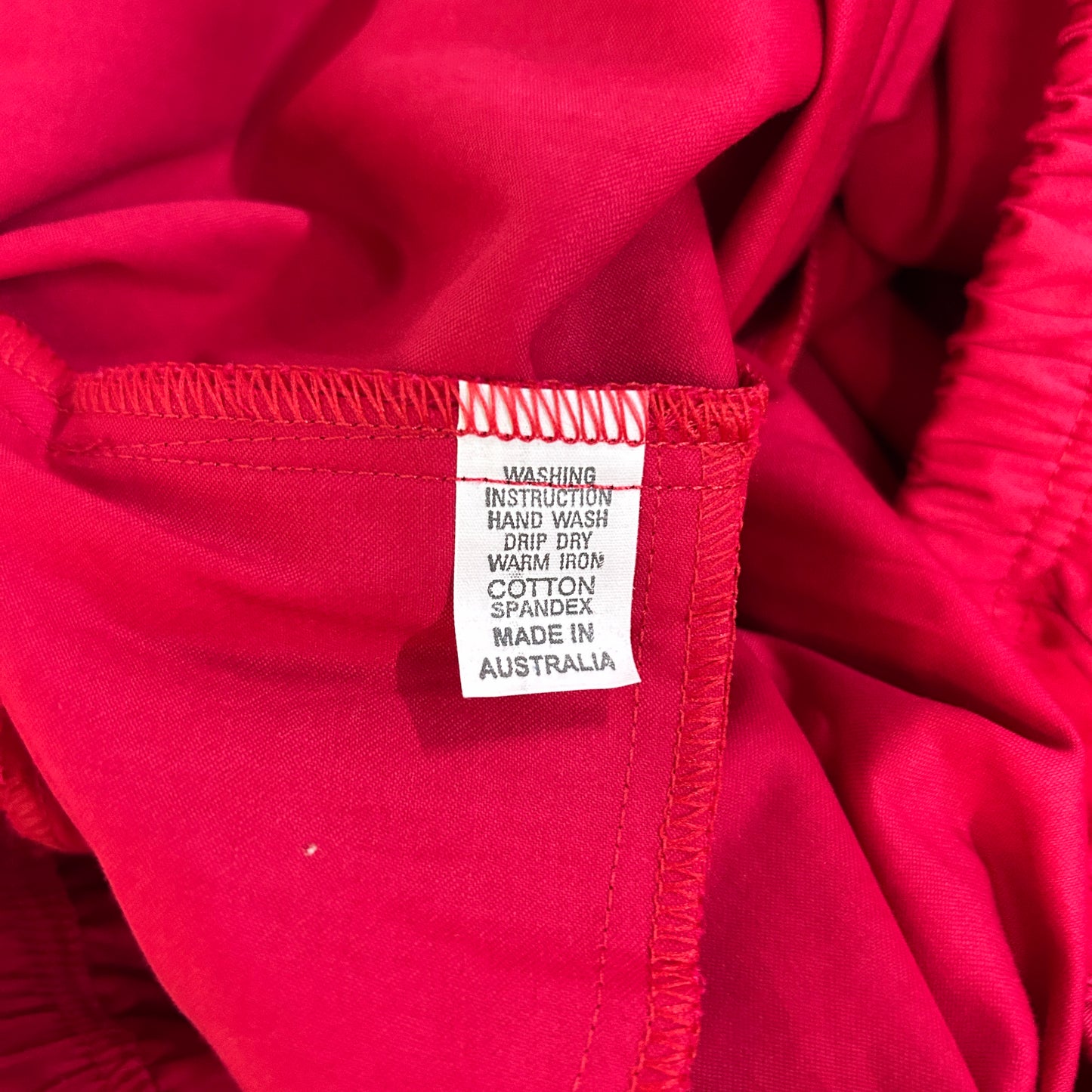 Red garment label detail view