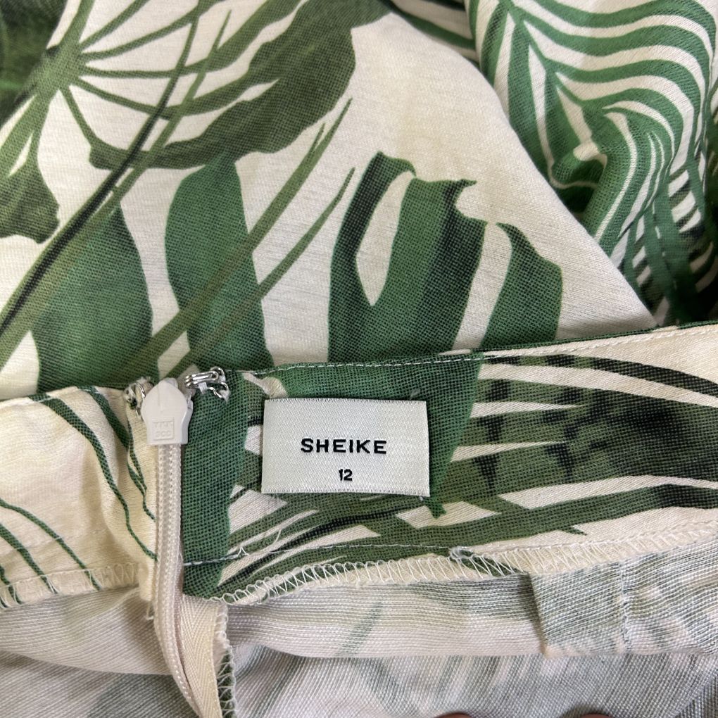 Green and white striped shirt label detail view