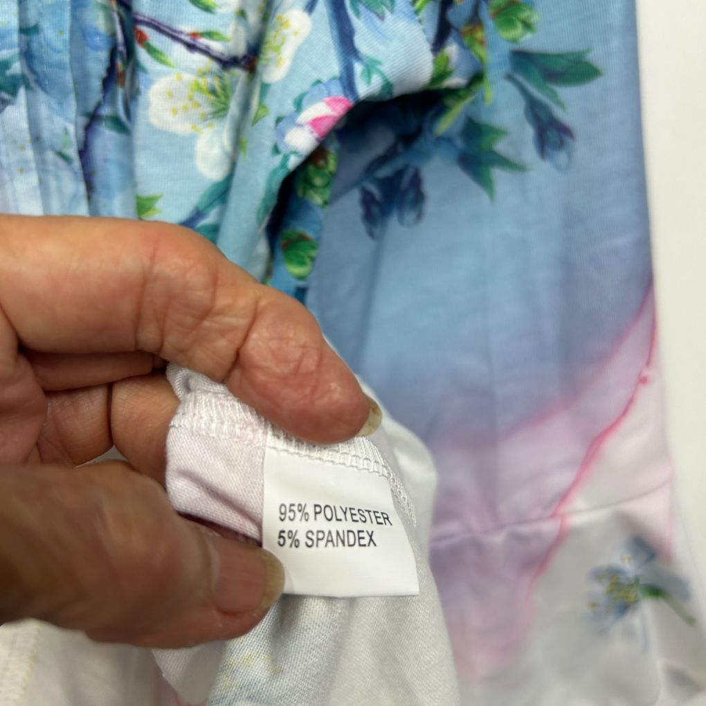Blue floral dress label detail showing fabric composition