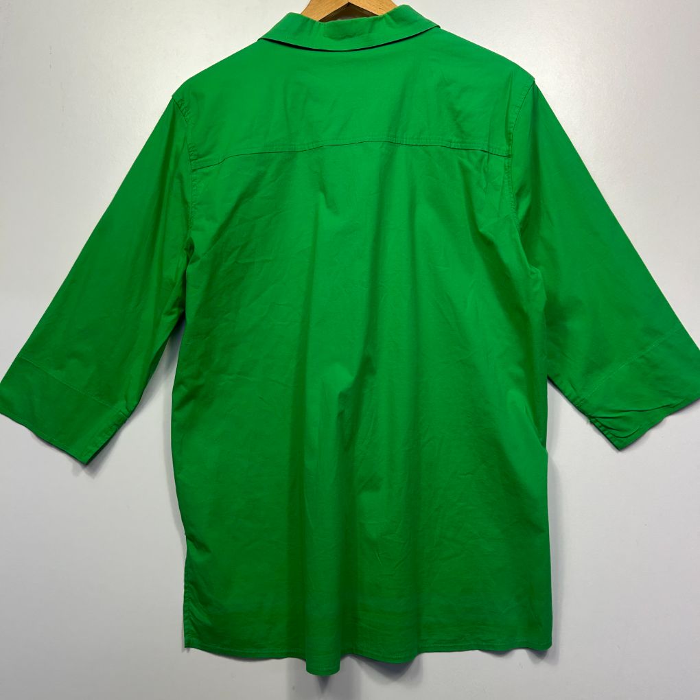 Green shirt back view