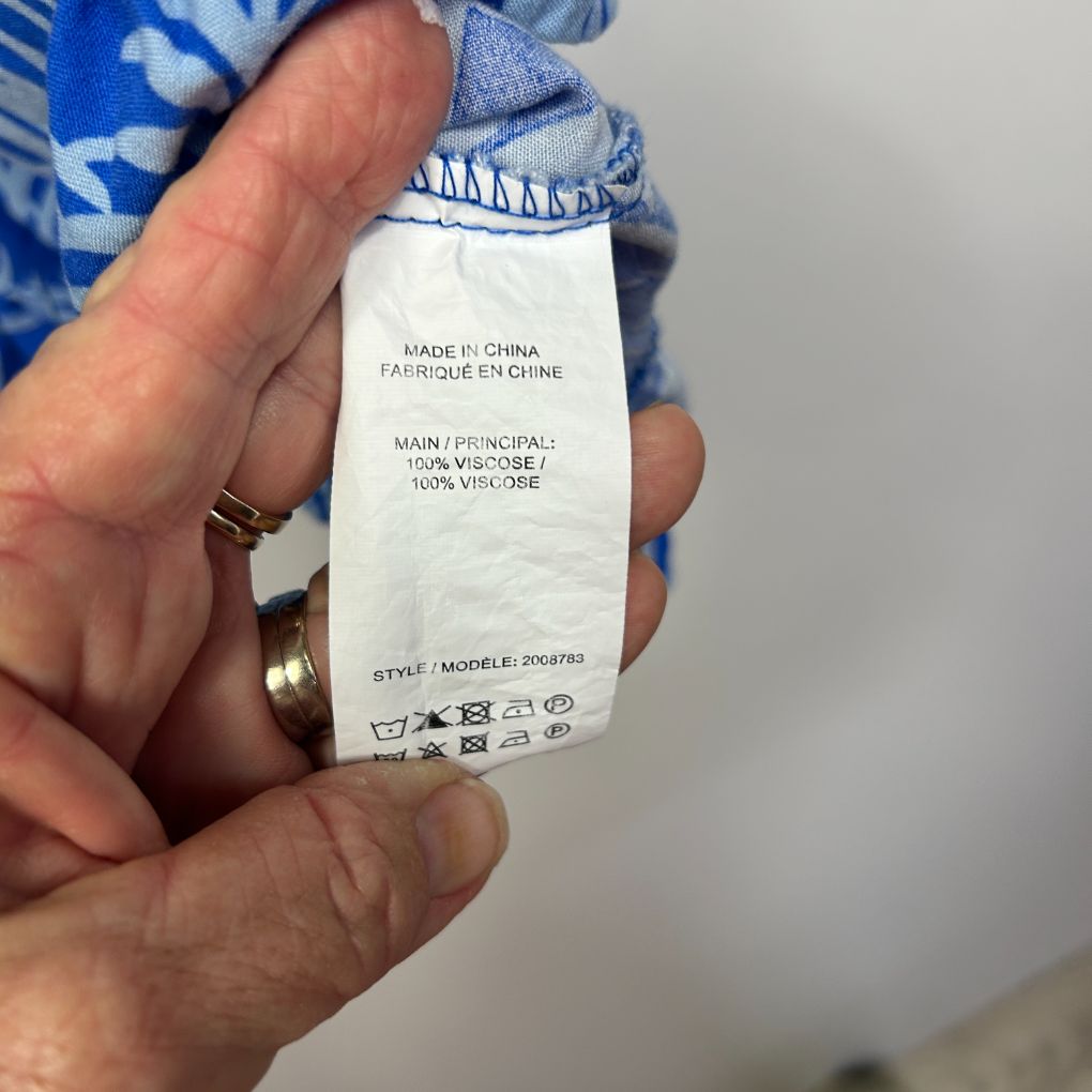 Blue and white clothing label detail view