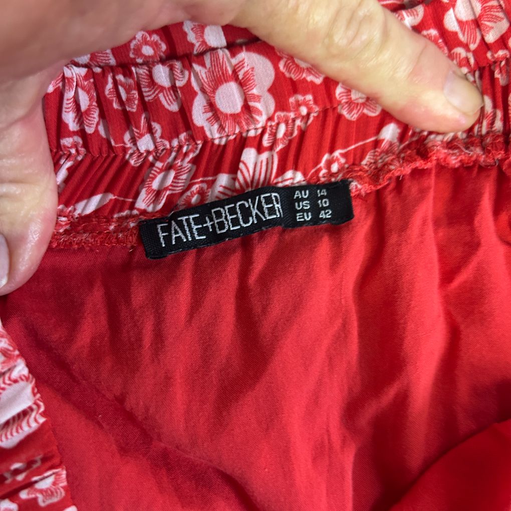 Red floral shorts label detail view