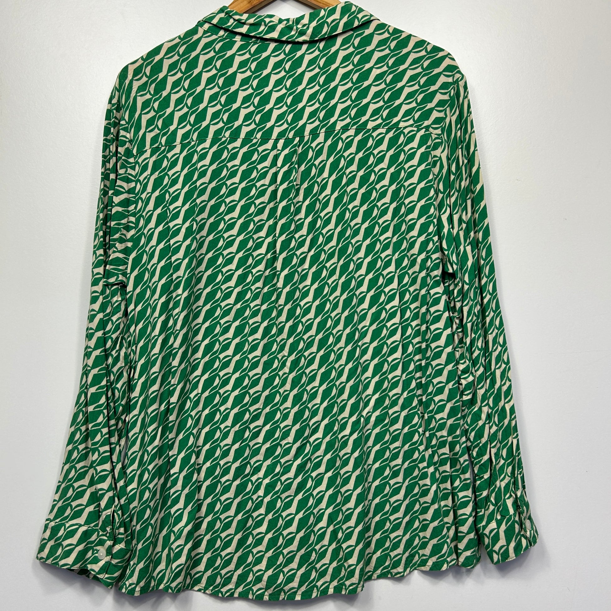 Green and white geometric patterned shirt back view