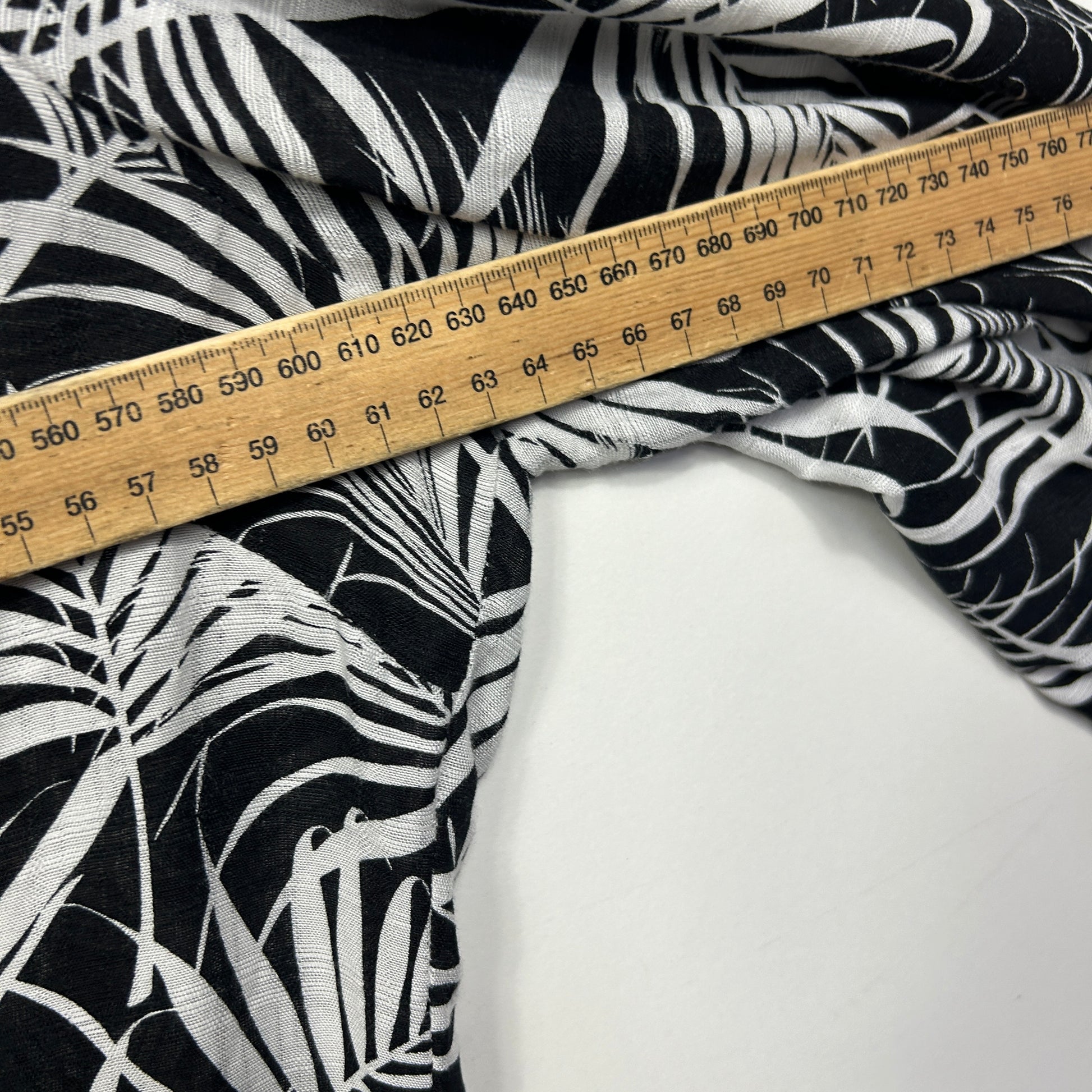 Black and white zebra print fabric detail view with measuring tape