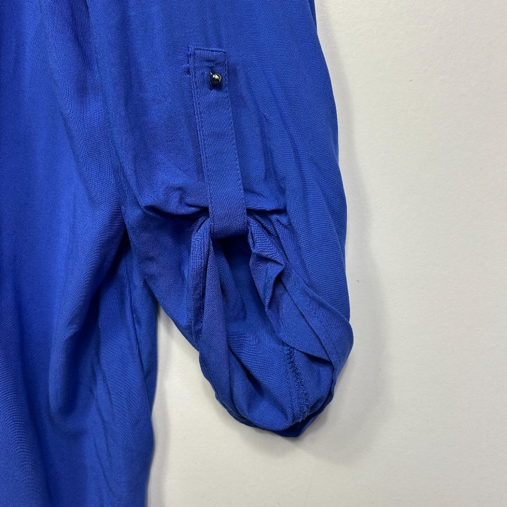 Blue shirt sleeve detail view