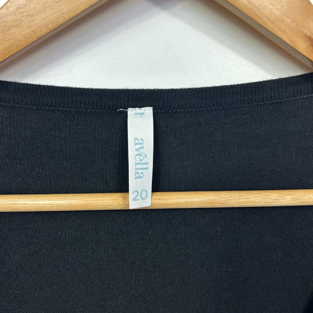 Black long sleeve top label detail view
