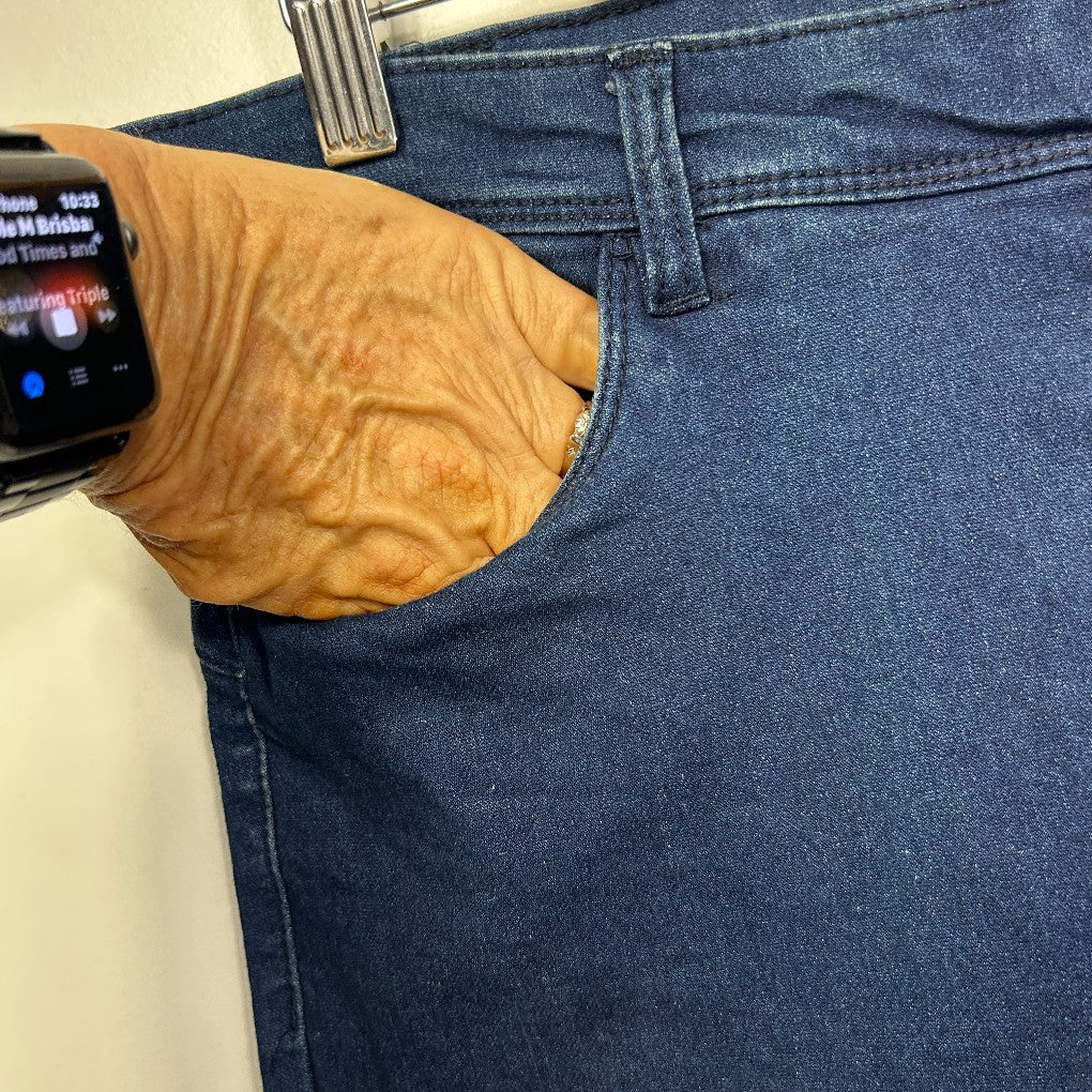 Blue denim jeans front view with wooden watch detail