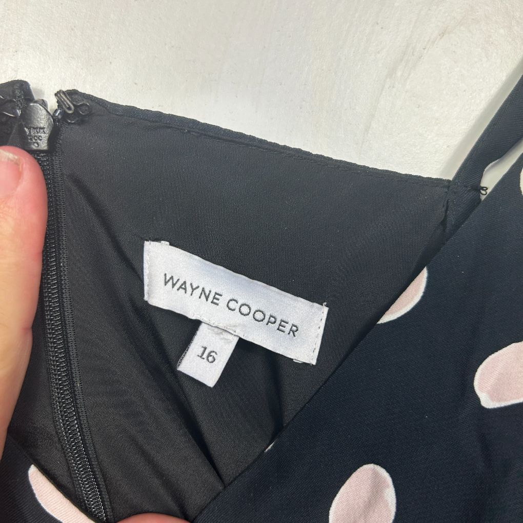 Black top with polka dot pattern label view