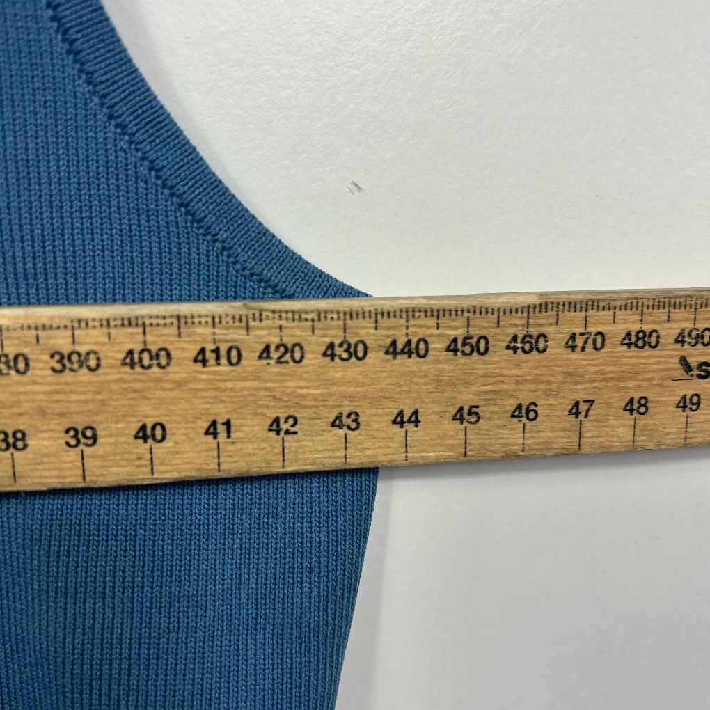 Blue ribbed fabric with measuring tape detail view