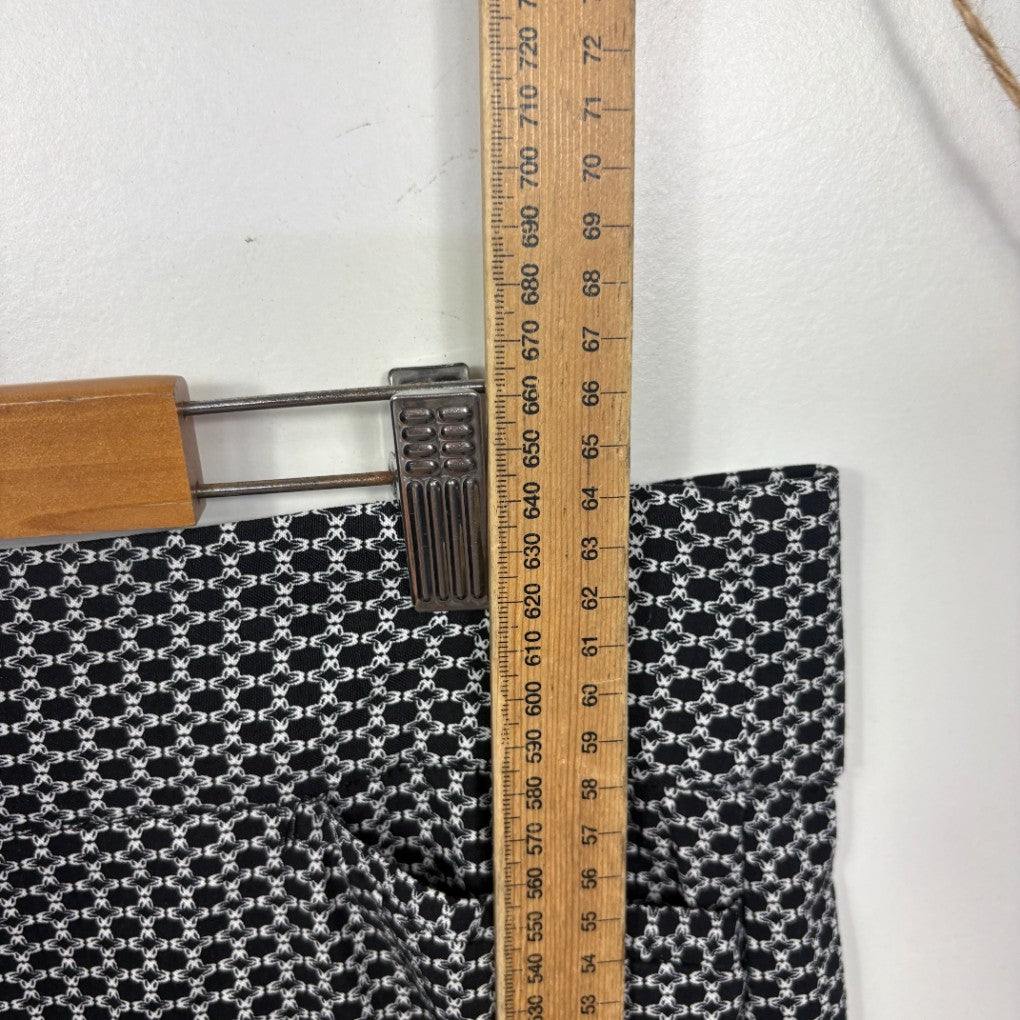 Black and white star pattern pants detail view with ruler measurement