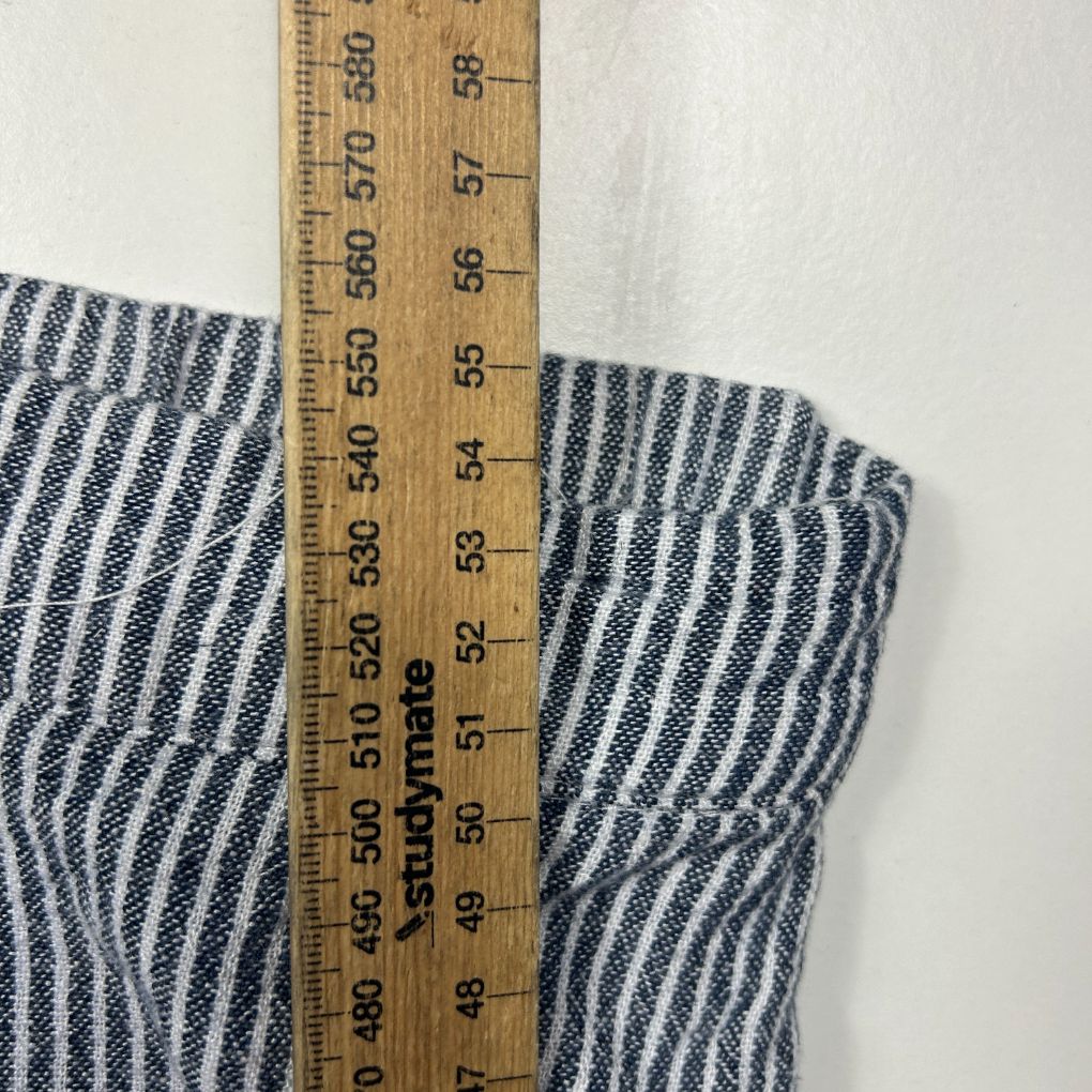 Navy and white striped fabric detail with measuring tape