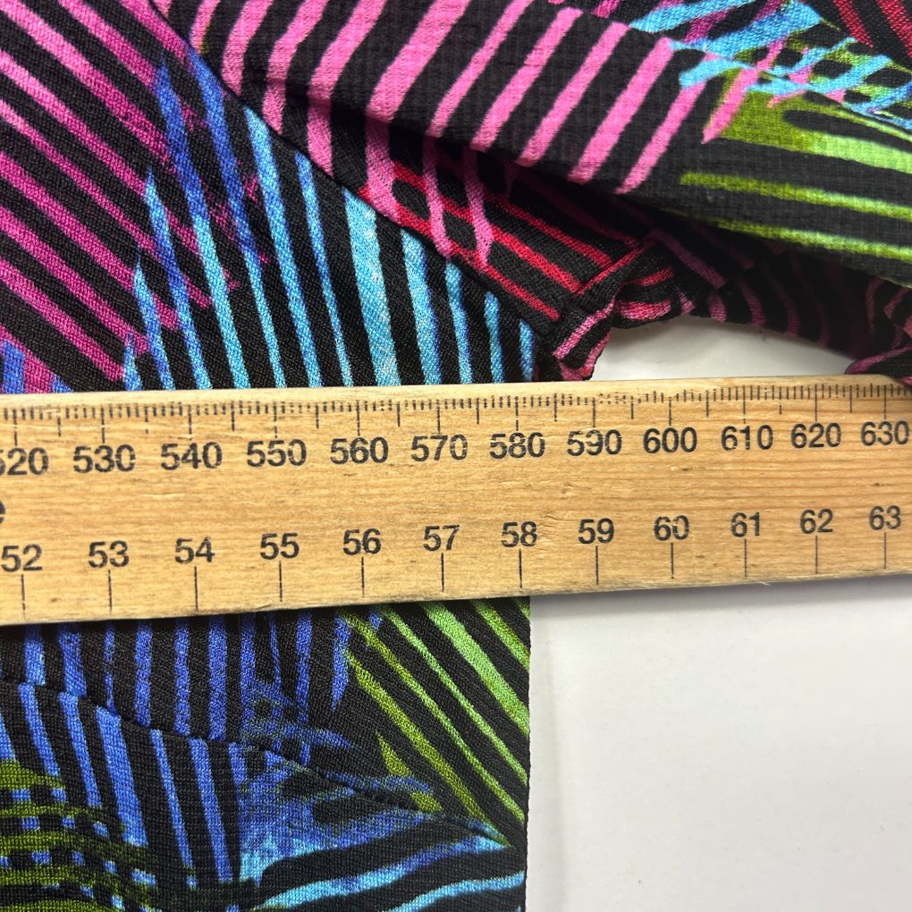 Colorful striped fabric detail view with measuring tape