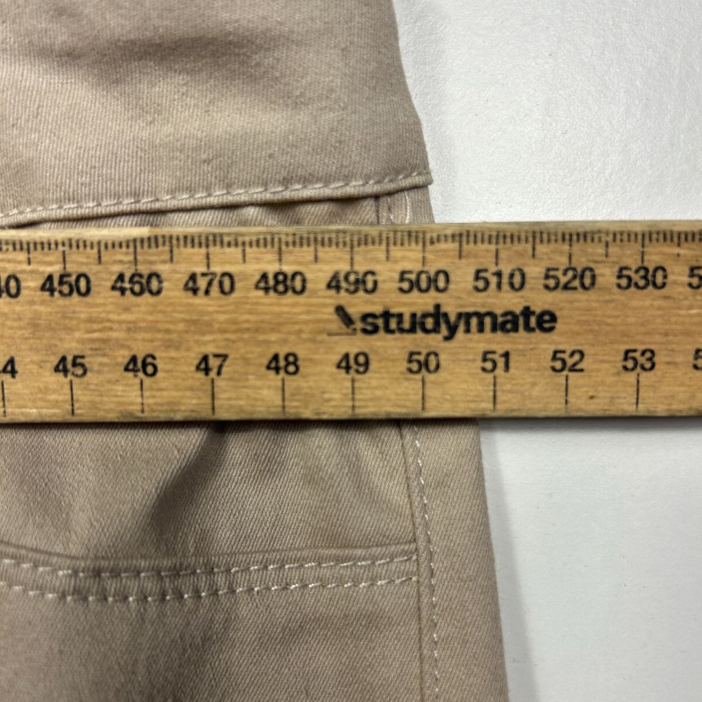 Beige shorts detail view with measuring ruler