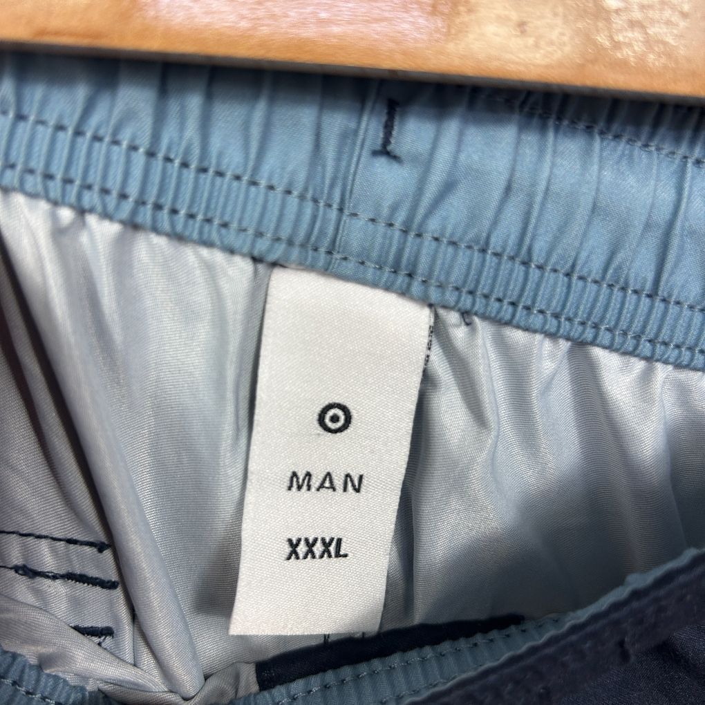 Blue shorts label detail view showing XXXL size tag