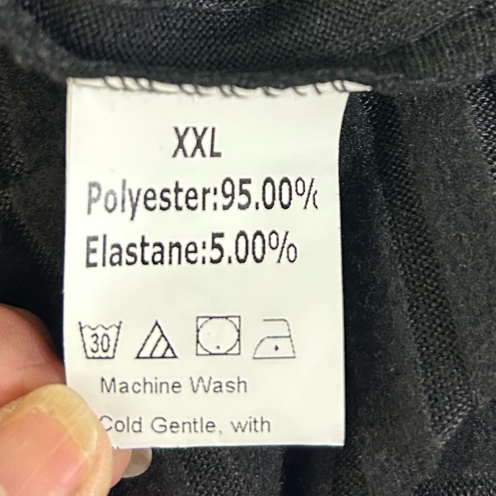 Charcoal grey fabric care label detail view