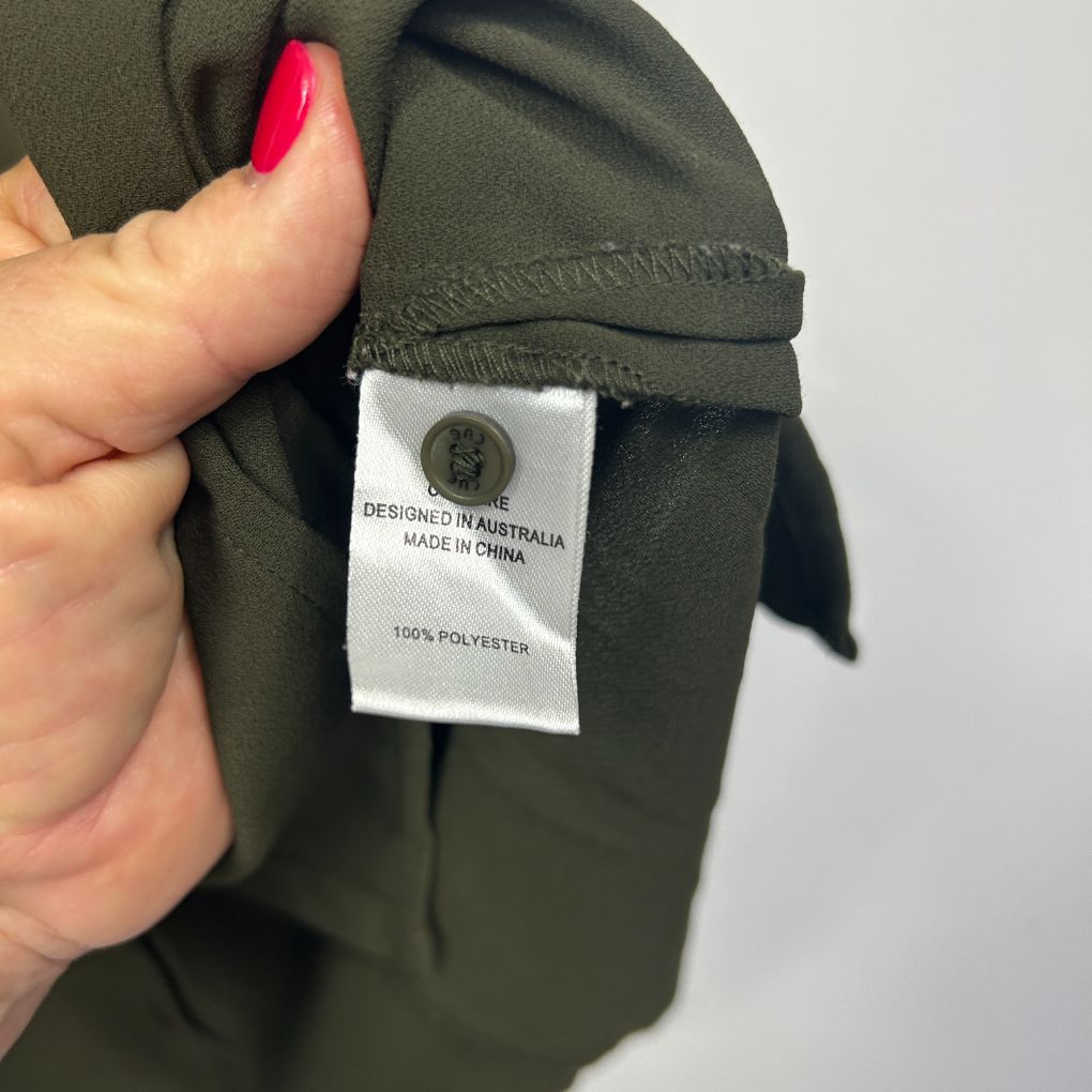 Olive green jacket label detail view