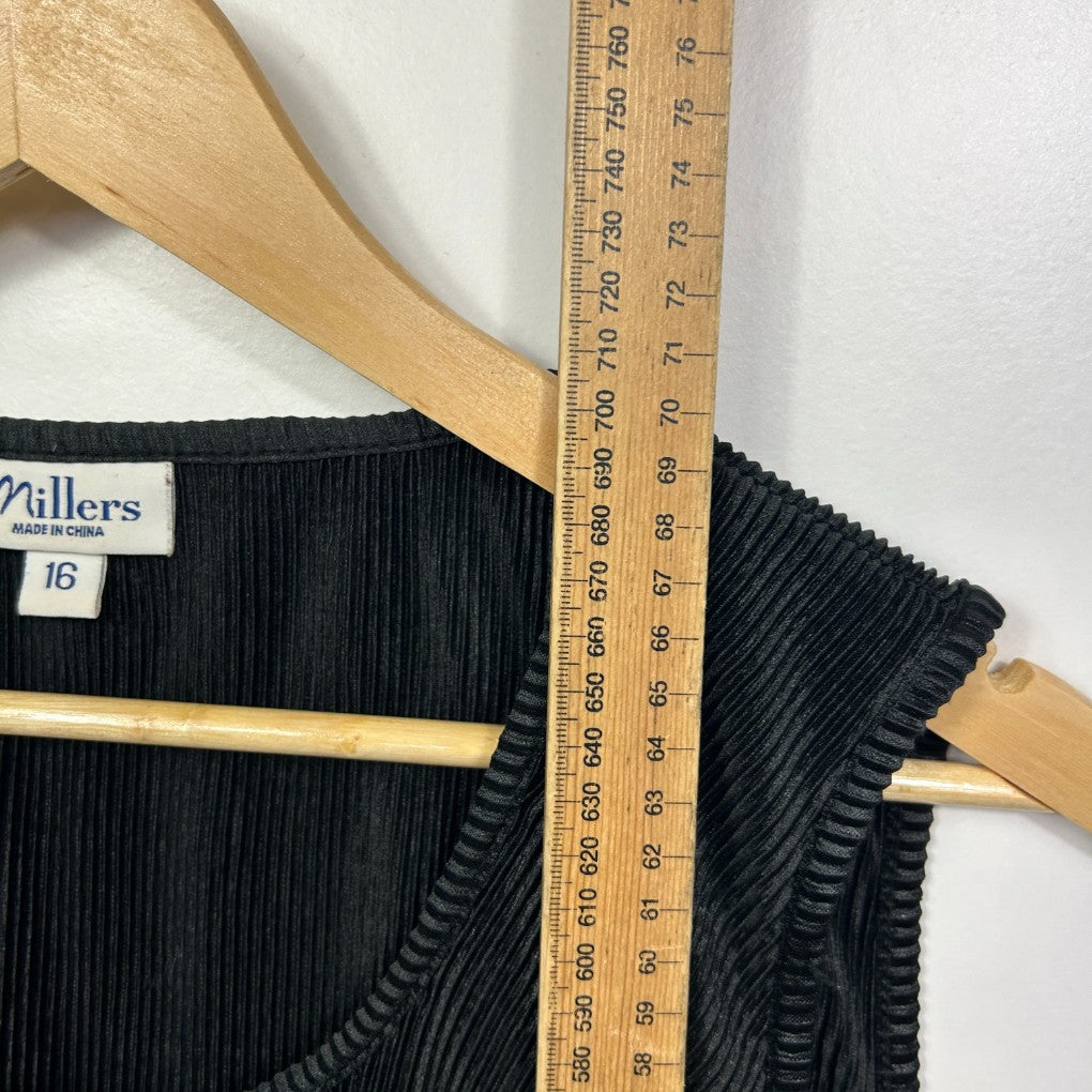 Black ribbed knit vest detail view with measuring tape
