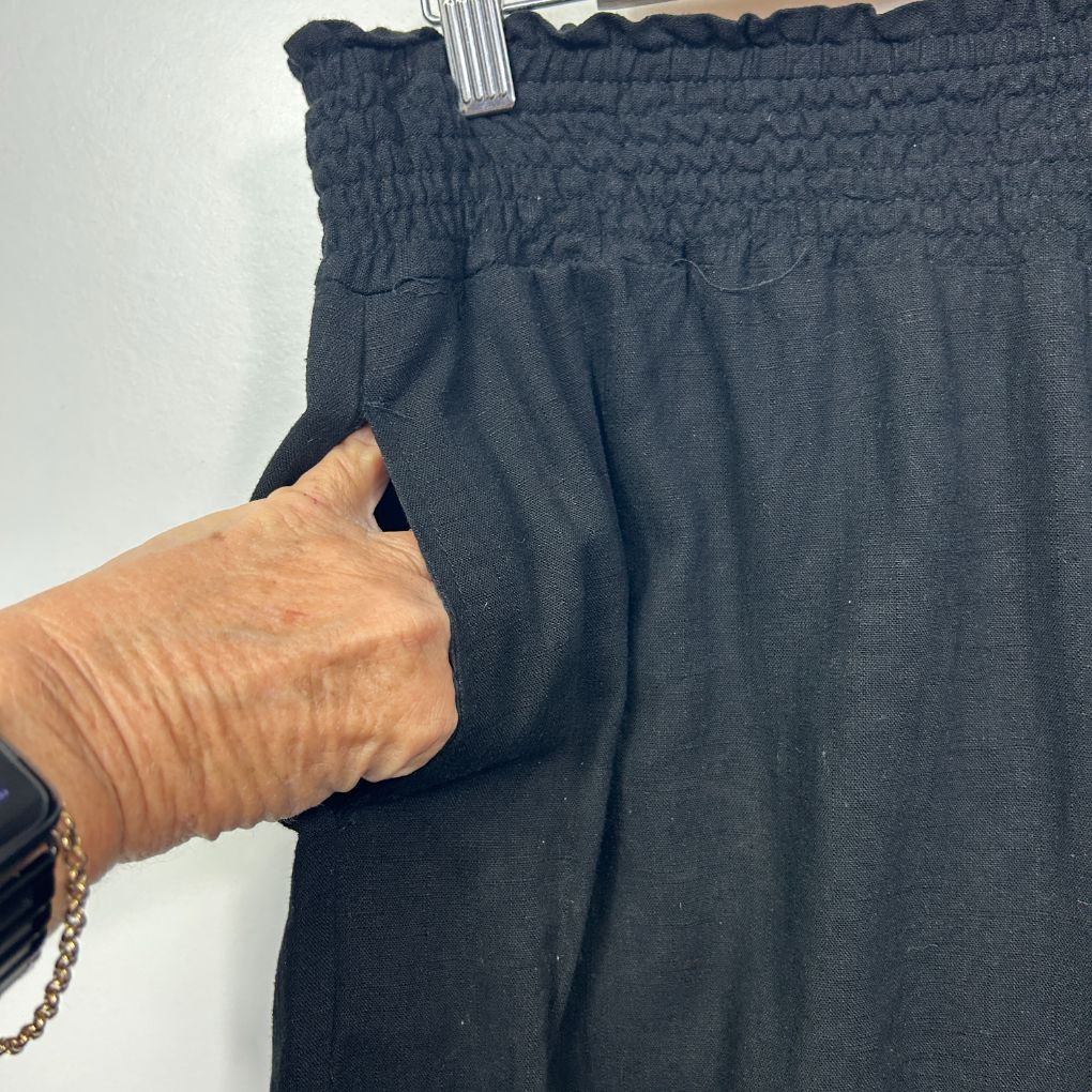 Black pants front view with smocked waistband