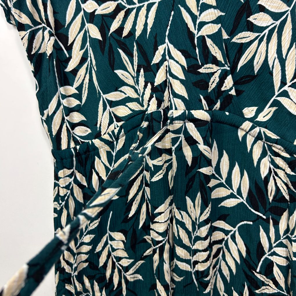 Teal and cream leaf print shirt detail view
