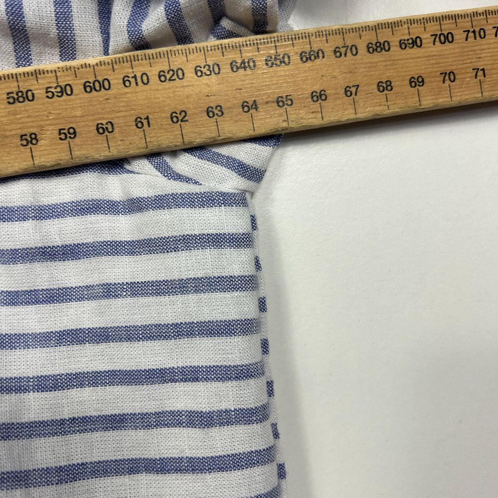 Blue and white striped fabric detail view with measuring ruler