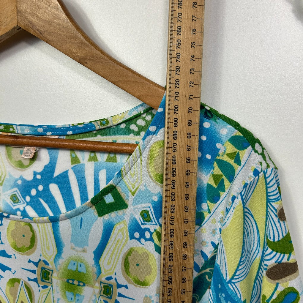 Blue green and yellow graphic print top detail view with ruler