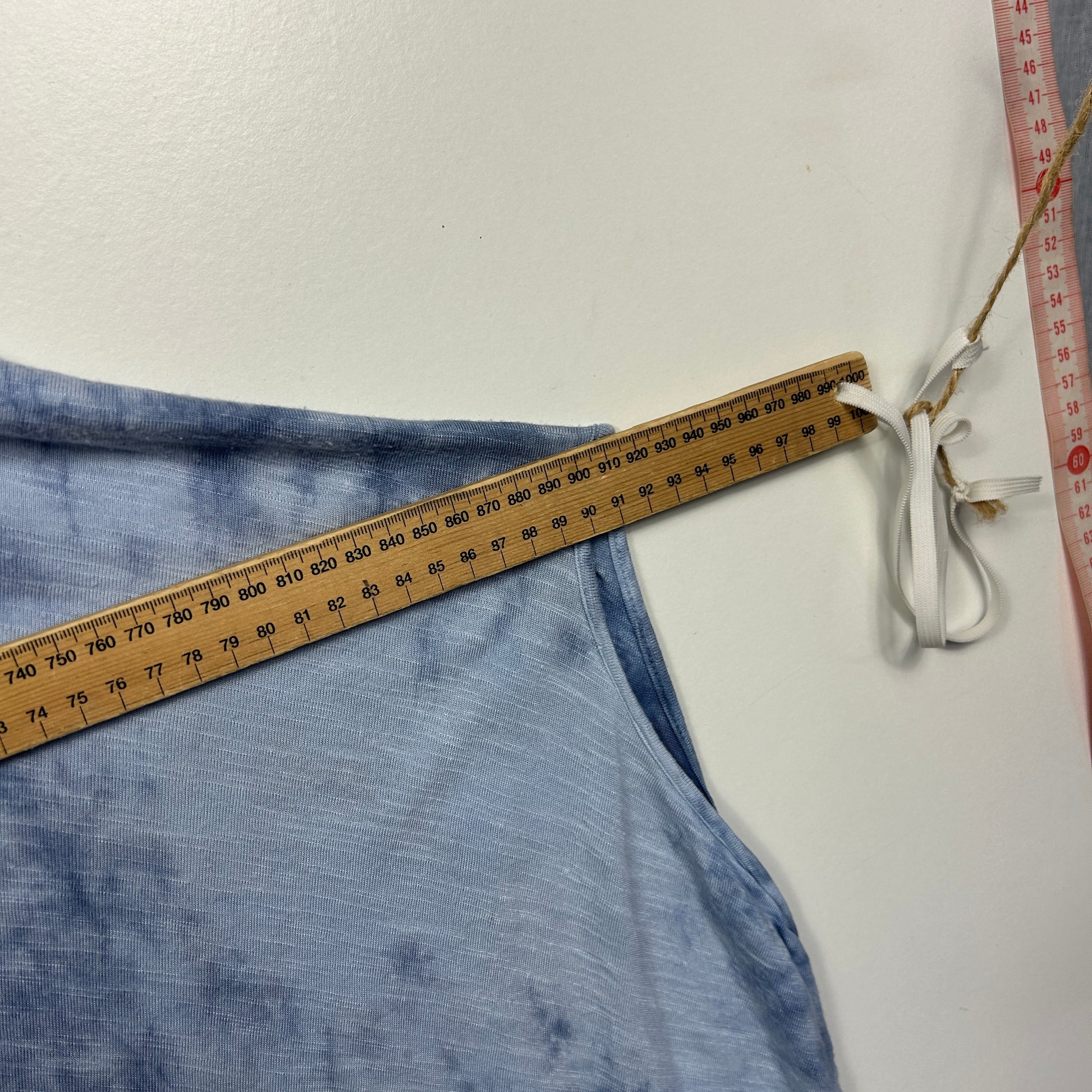 Blue skirt waistband detail with measuring tape