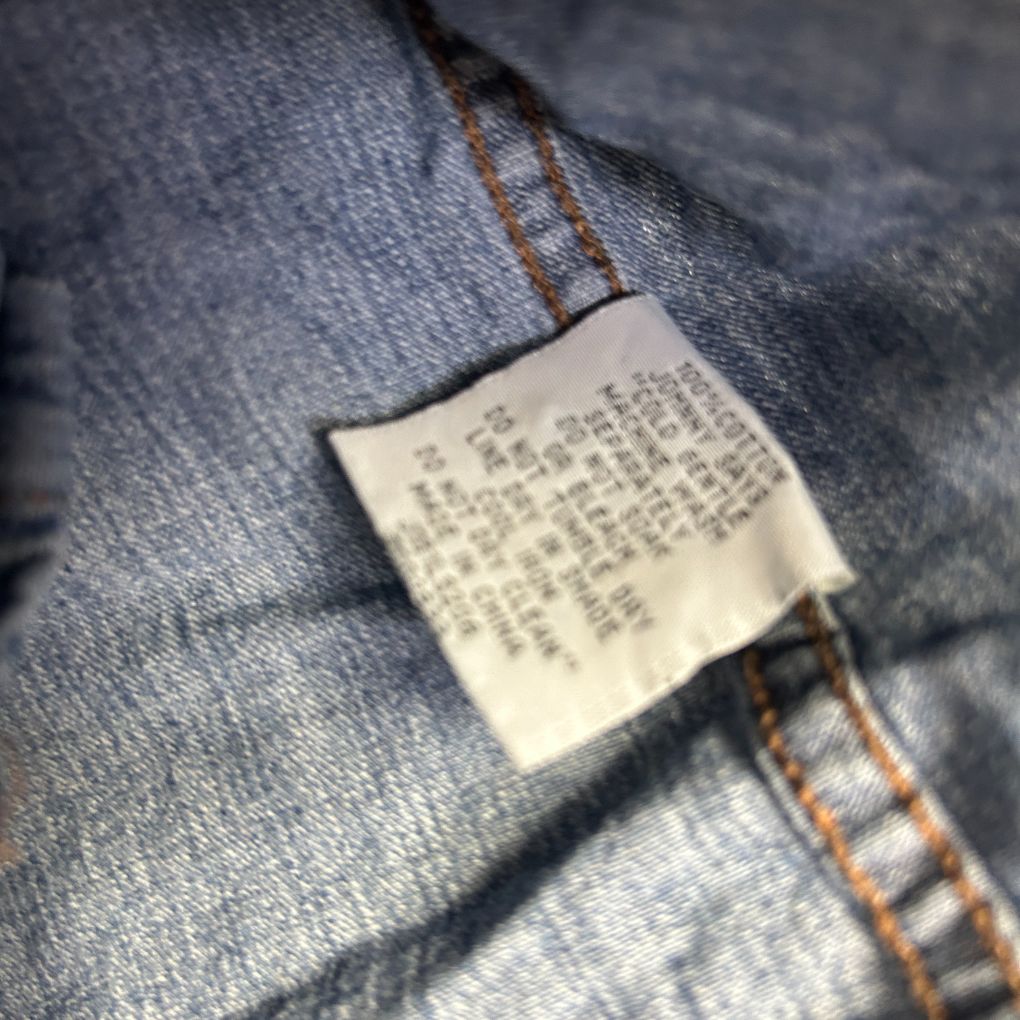 Blue denim jeans label detail view