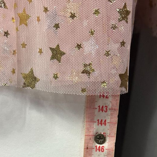 Pink star print fabric with white underlay detail view
