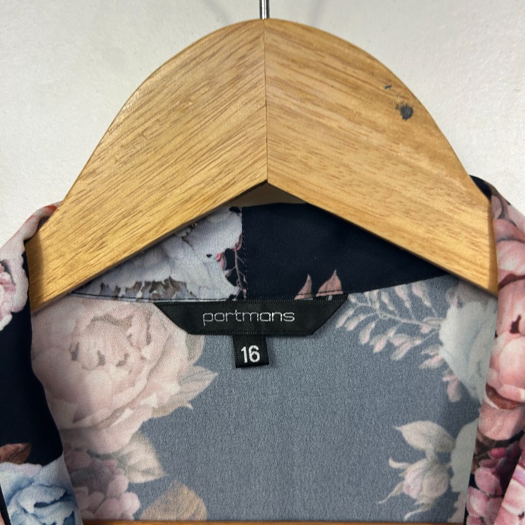 Floral dress front view on wooden hanger